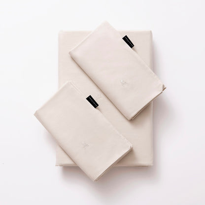 Set Cama 4pc (sábana Bajera 150x200+28cm + Sábana Encimera 230x270cm + 2 Fundas Almohada 50x85cm) 100% Algodón Beige Scalpers Home