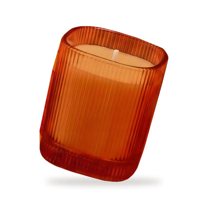 Vela perfumada Oriental Oud en vaso rayado naranja 9x8 cm Roura